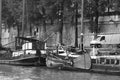 Tourist boat floats on the channel near Notre Dame de Paris. Royalty Free Stock Photo